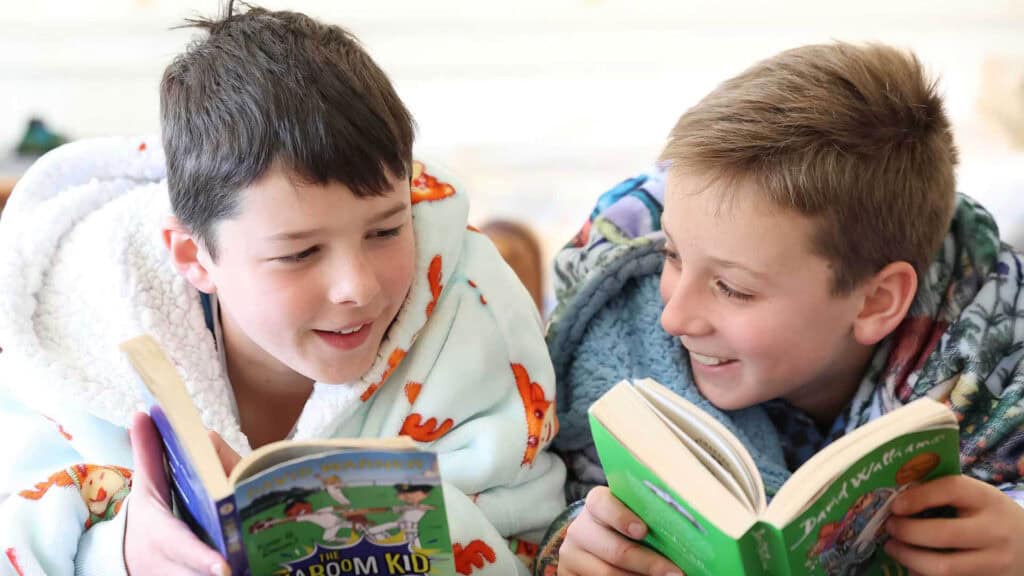 Tudor House students reading books in the boarding house