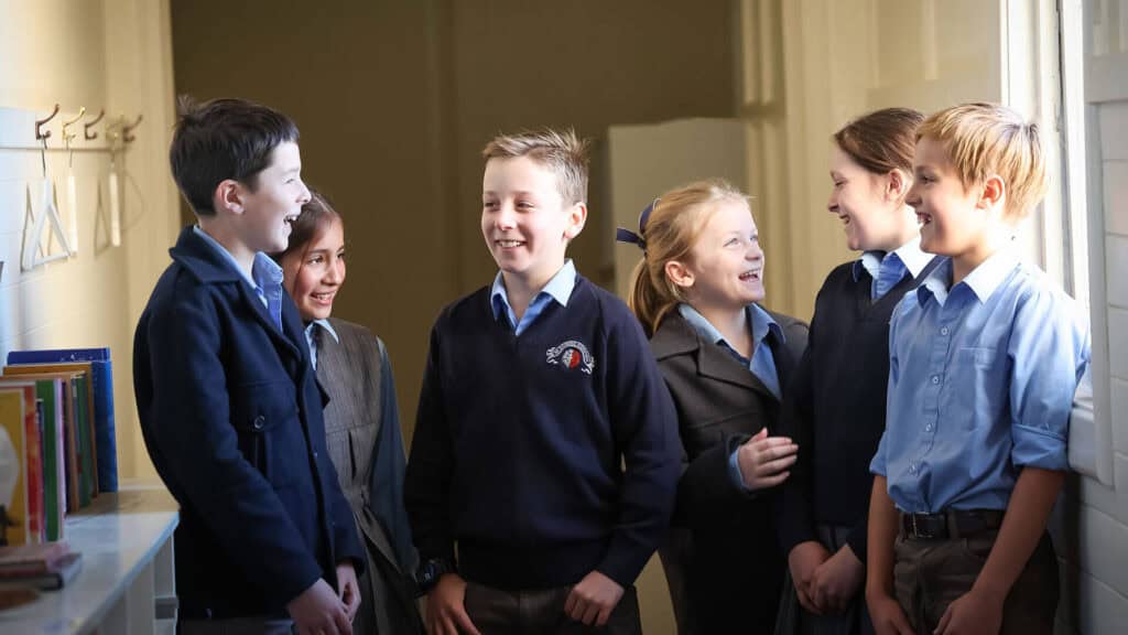 Tudor House boarding students talking and laughing in the boarding house