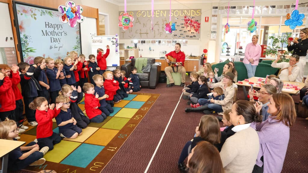 Tudor House students performing to their parents a song in the classroom
