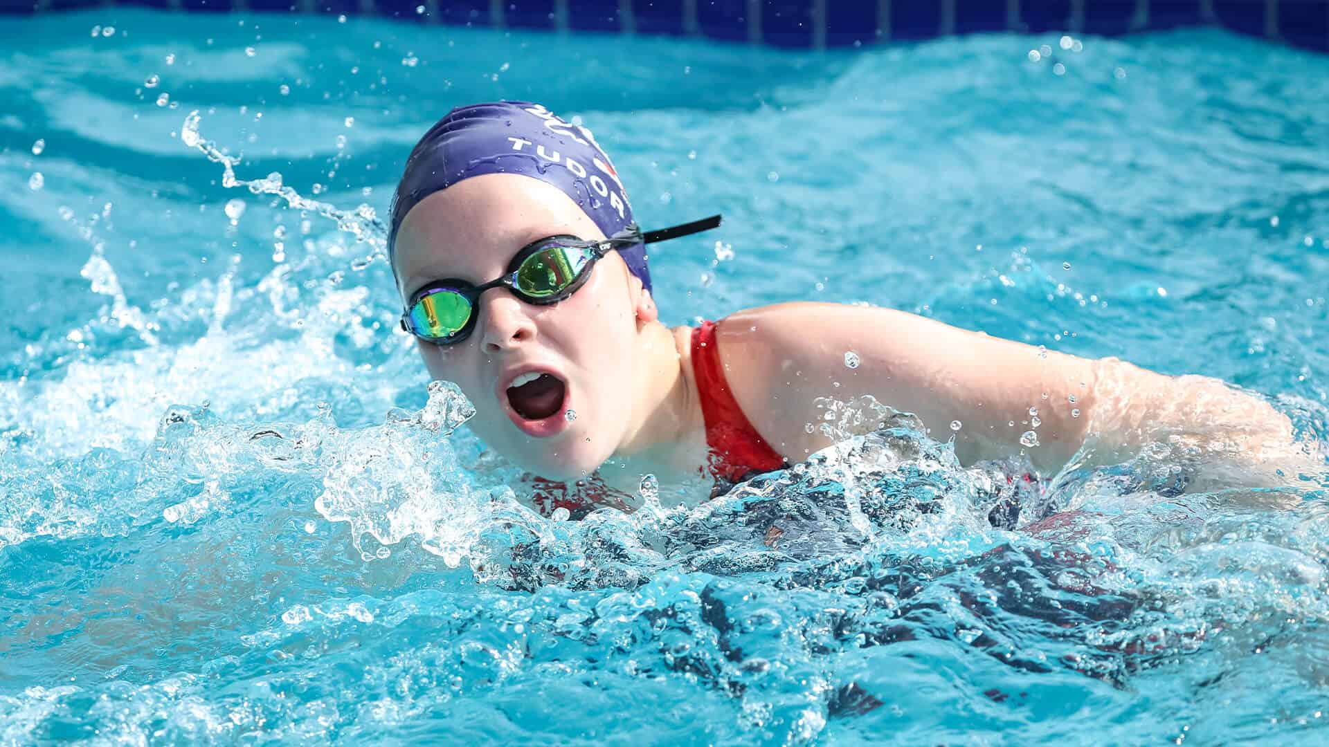 Tudor House student swimming in the school pool