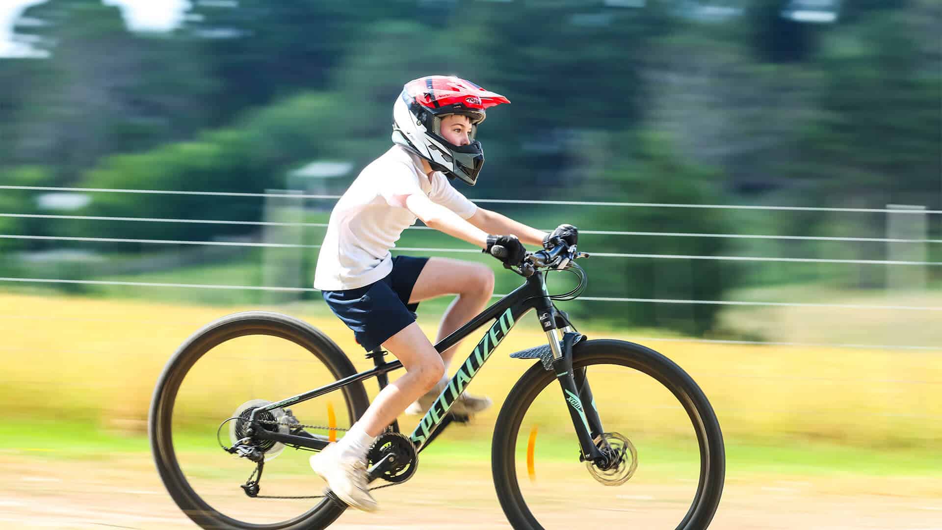 Tudor House student riding his bike
