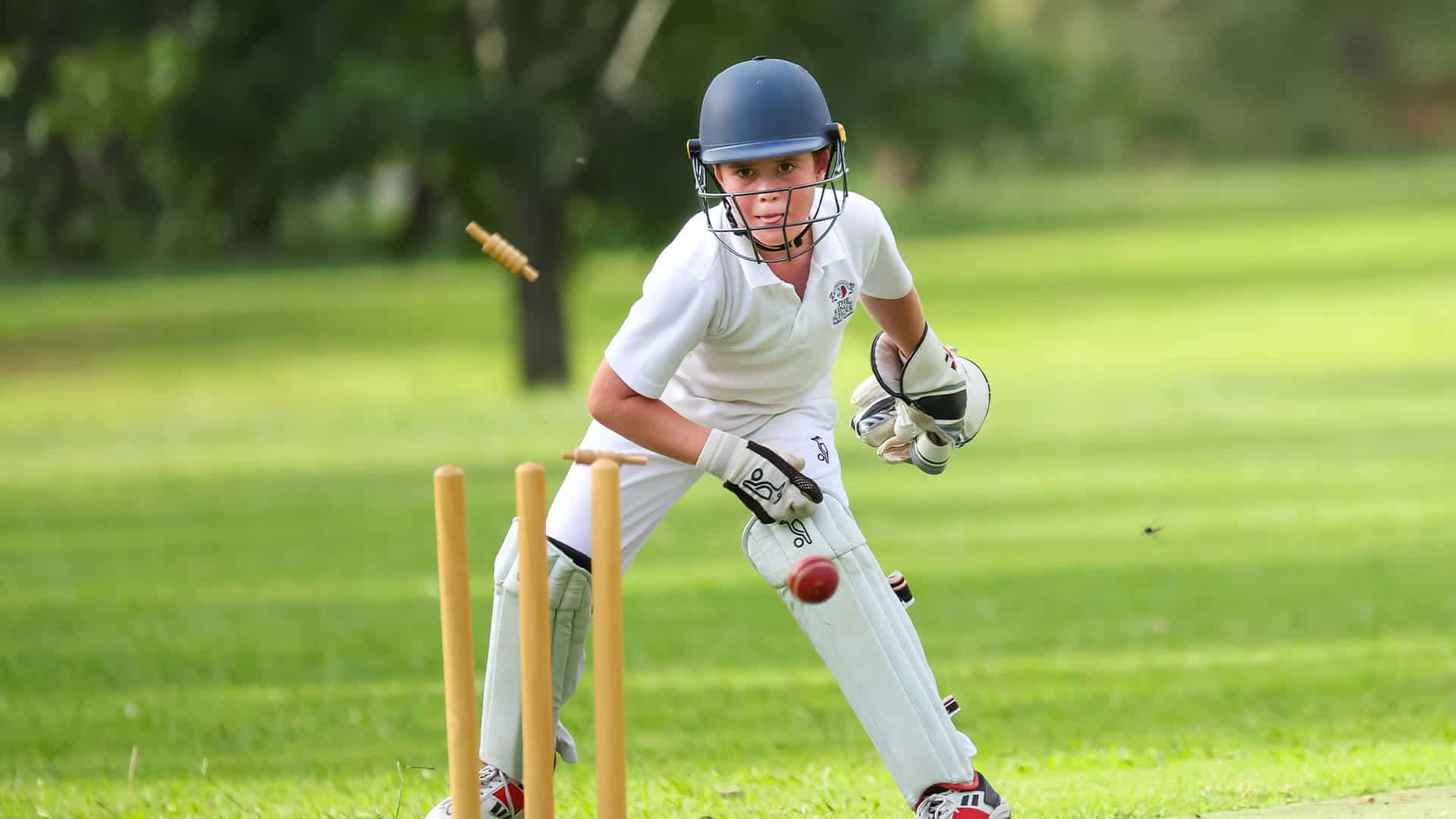 Tudor House student playing cricket