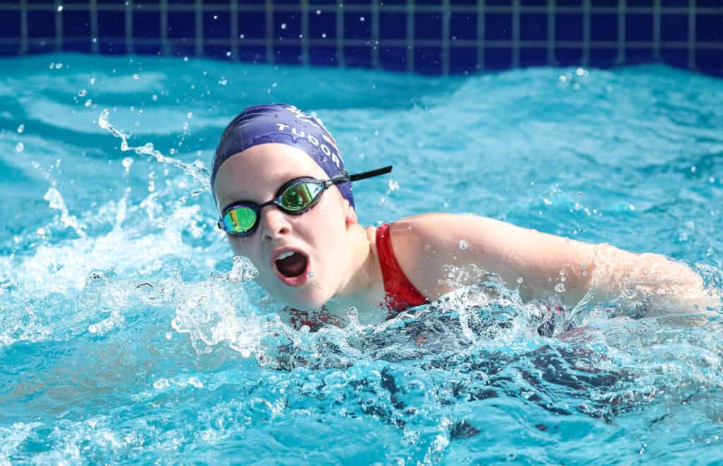 Tudor House student swimming in the school pool
