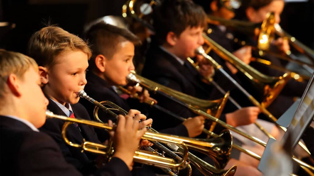 Tudor House students playing the trumpet in a group performance