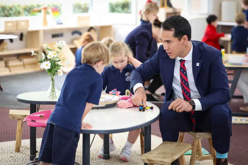 Head of Tudor house in a classroom interacting with Tudor House pre-kindergarten students
