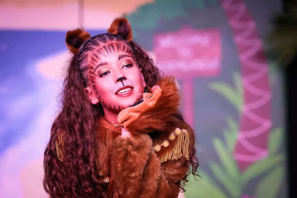 Tudor House student in costume on stage for a musical theatre performance