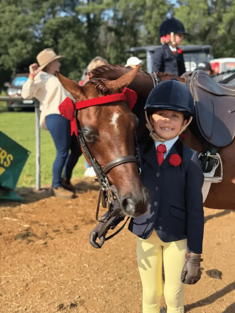 Student riding horse