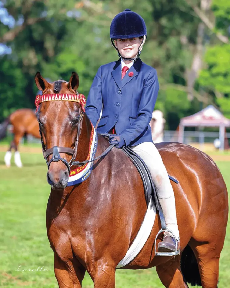 Student riding horse