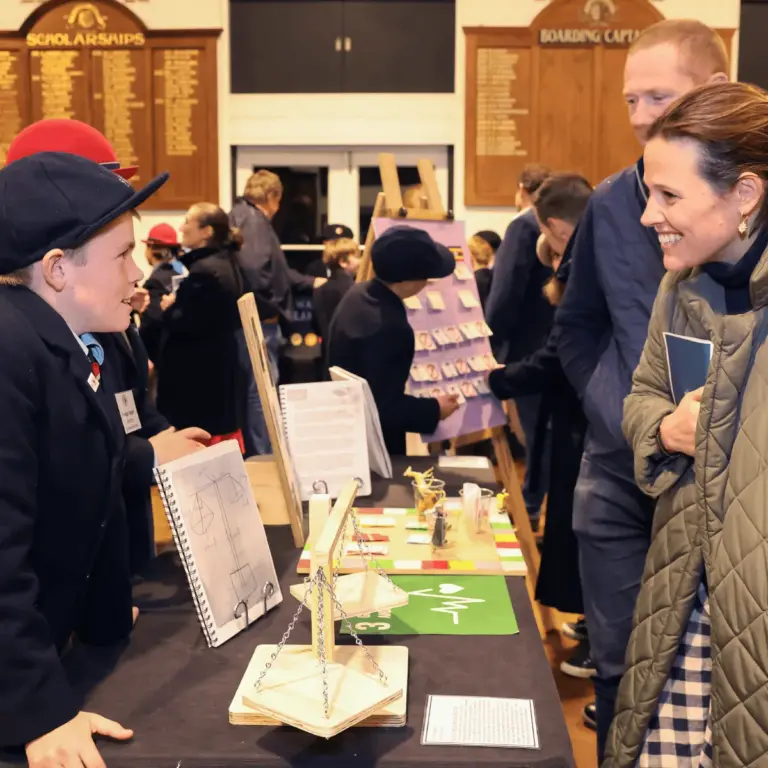 A Tudor House student presenting their work at the IB PYP Exhibition