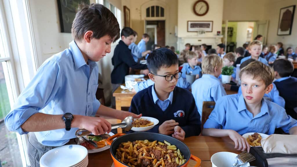 Boarding students eating in the school dining hall