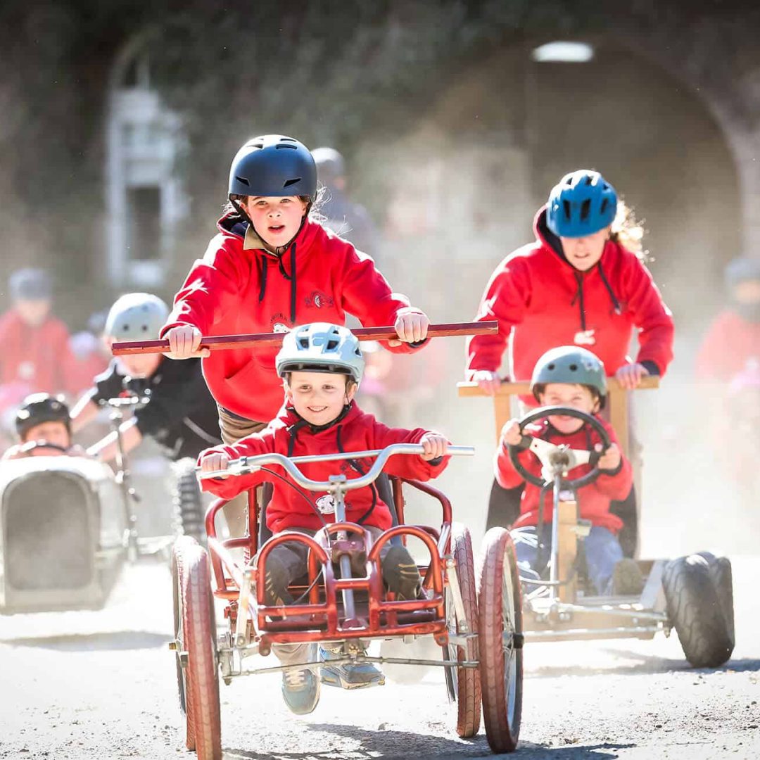 Tudor House students participating in Billy Cart Derby